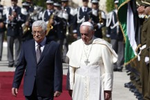 (RNS1-may30) Pope Francis reviews the honor guard with Palestinian President Mahmoud Abbas during an arrival ceremony at the presidential palace in Bethlehem, West Bank on May 25, 2014. For use with RNS-POPE-BETHLEHEM, transmitted on May 30, 2014, Photo by Paul Haring, courtesy of Catholic News Service